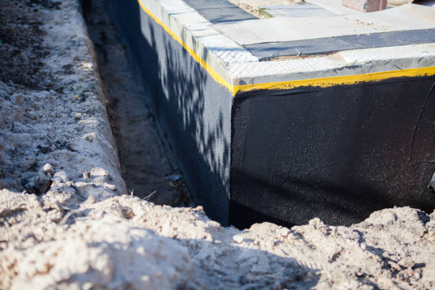 Professional Basement Waterproofing technician working in Sparta, OH